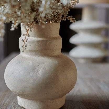 Rustic texture on a sculptural paper mache vase.