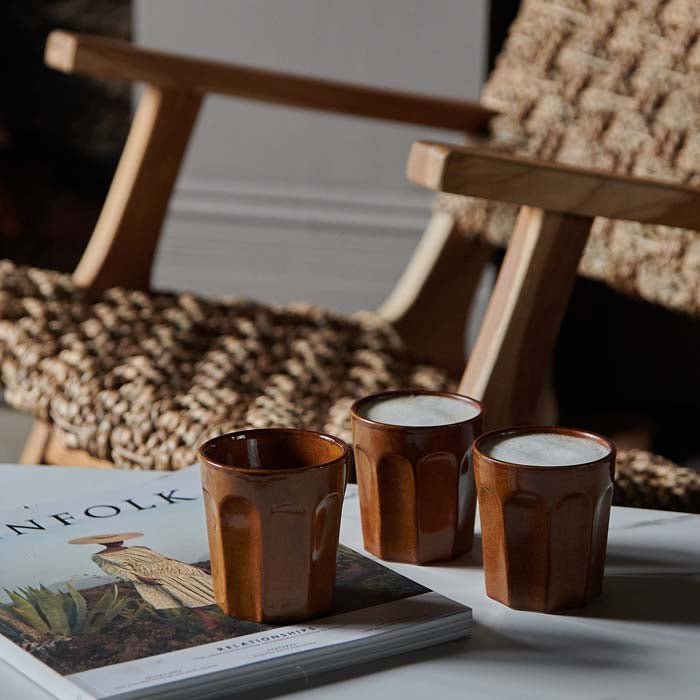 The Franco Stoneware Mug - Set of 4, a set of four stoneware tumbler cups in amber brown glaze and fluted design.