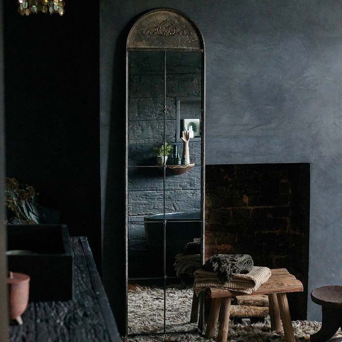 The Ashford Mirror, a full-length narrow arched window-pane style mirror in a bathroom.