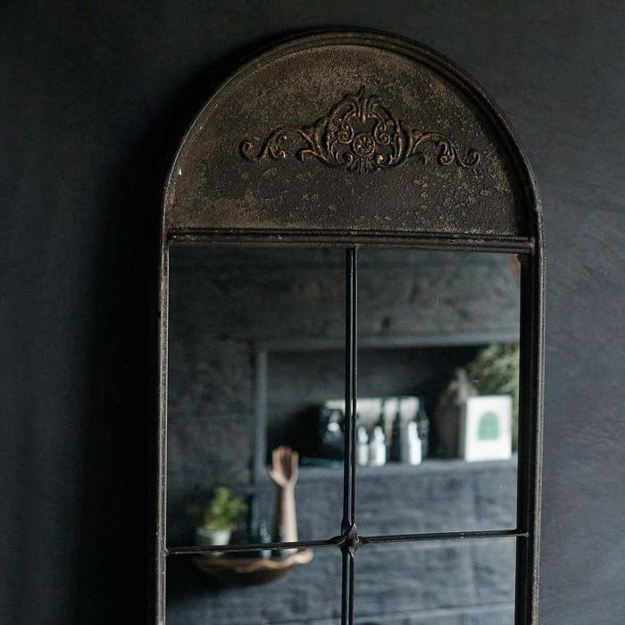 Decorative arched relief top of the Ashford Mirror.