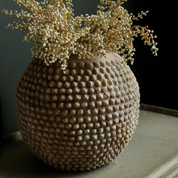 Round bobble vase in rustic brown cement.