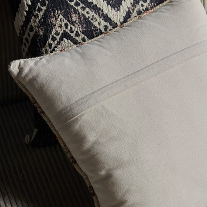 Concealed zip on the back of a square cushion.