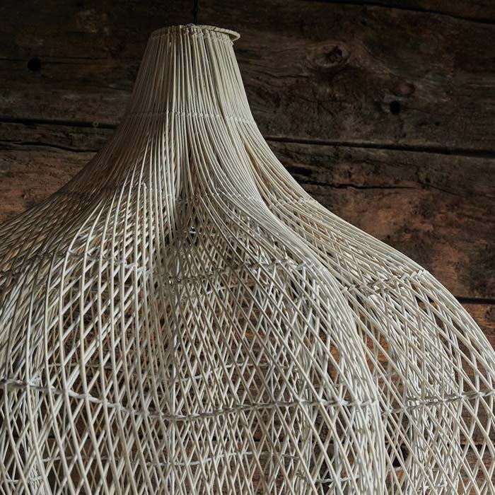 A closeup of the woven detailing on the Sarria Rattan Pendant.