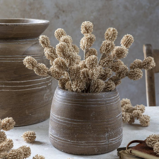 Very realistic small faux flowers to add a natural look to flower bouquets. Luxury artificial flowers that look lifelike from Abigail Ahern known for boundary pushing designs styled into a ceramic vase. Meadow pom pom flowers that add an unsual element to floristy arrangements.