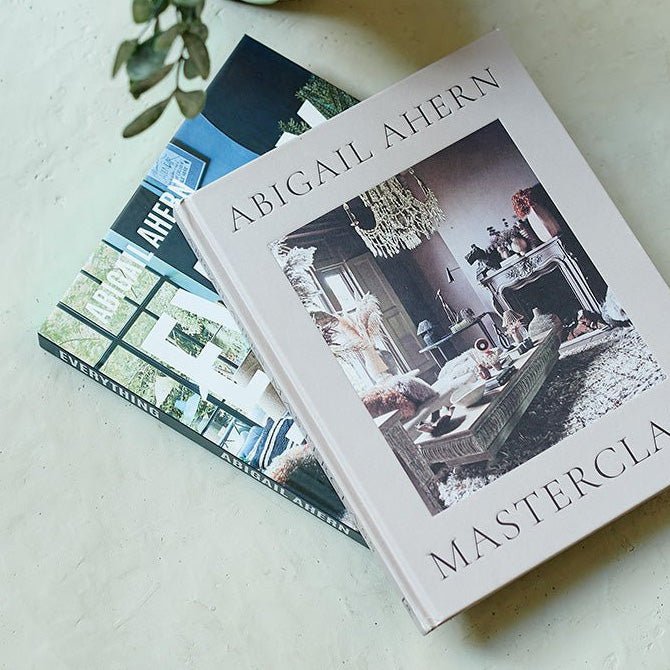 Two hardback books by Abigail Ahern with images of her interiors.