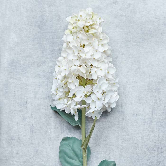 Cream fake flowers that look real. These faux flowers look stylish as a single stem or in a fake flower bouqet.
