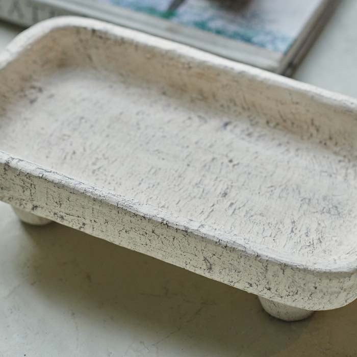 Detail image of a small rectangular cement tray.