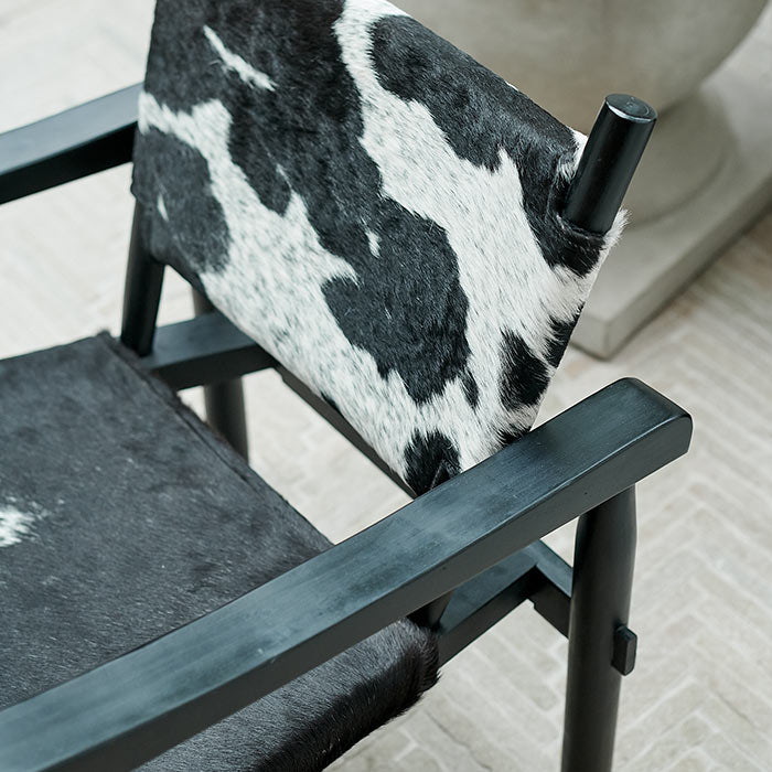 A closeup of the cowhide print on the seat of the Tilbury Hide Chair.