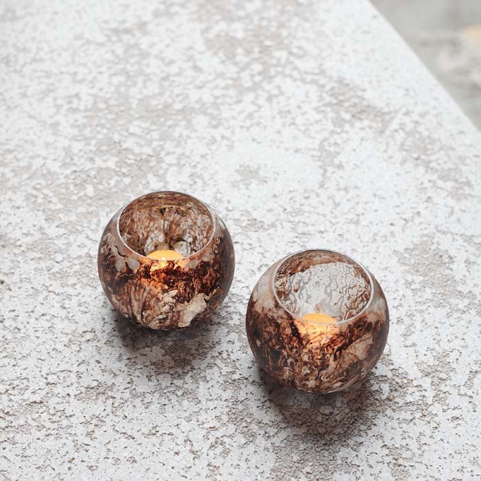 Opa Set of 3 Tealight Holders, a trio of small round votives made from glass with a frosted swirled white and brown finish.