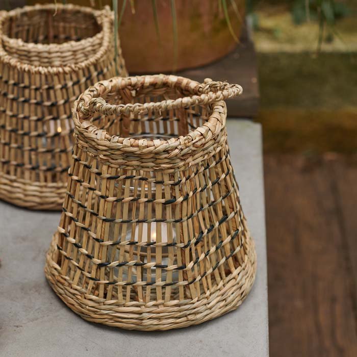 A closeup of the woven seagrass detail on the Etelle Seagrass Lantern.
