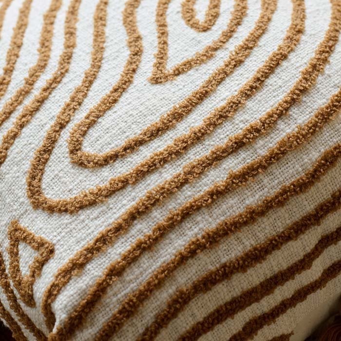 A closeup of the organic radiating pattern on the Demelza Embroidered Cushion.