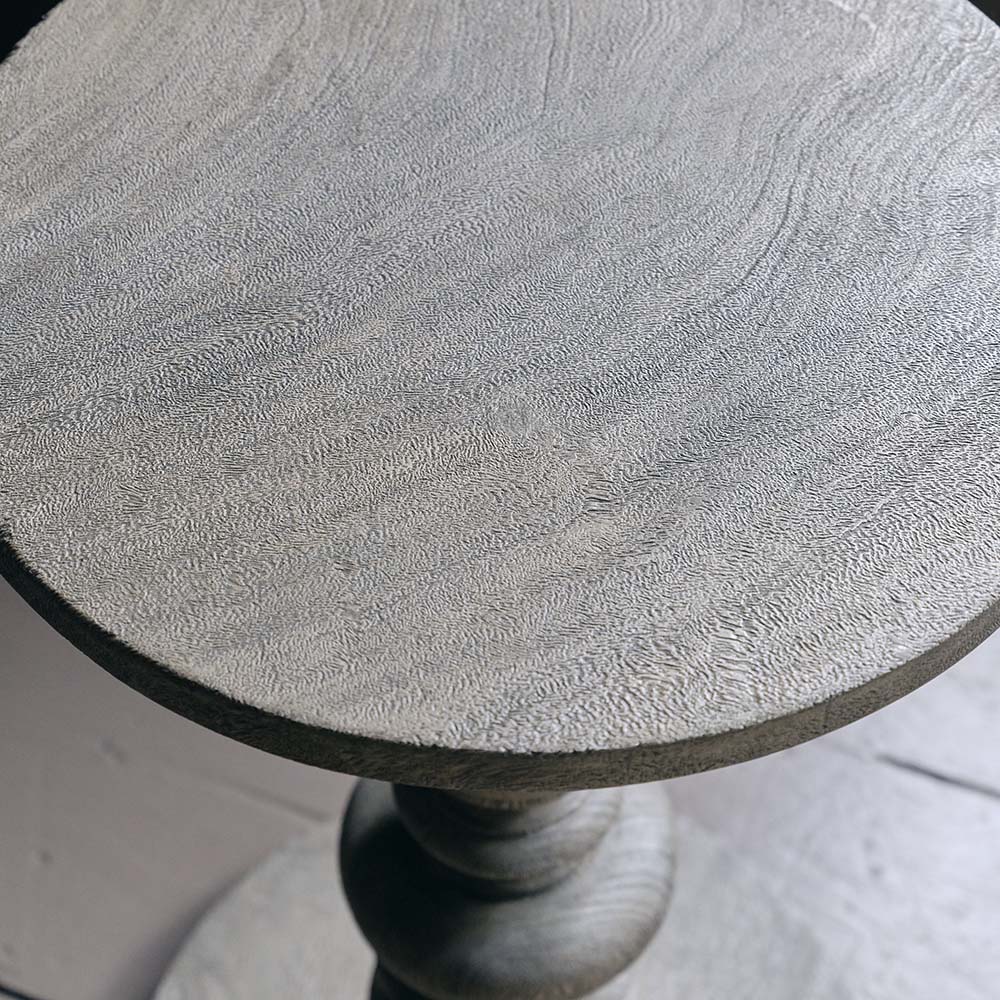 Close-up of the Abigail Ahern Devon Wooden Side Table showcasing the rich, characterful grain and warm natural tones of solid suar wood.