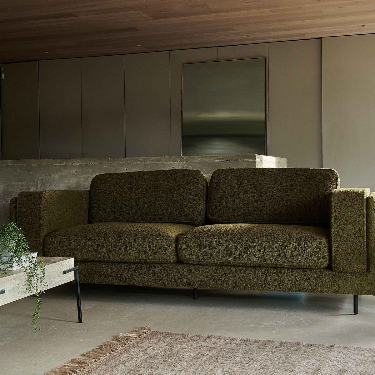 Eartha sofa olive green boucle two seater black metal legs modern living room Abigail Ahern furniture