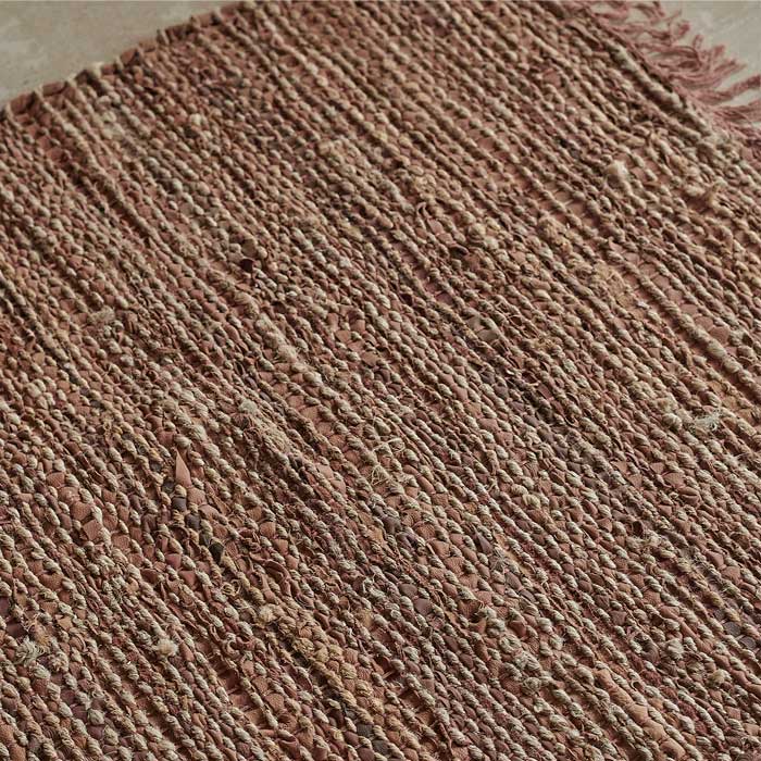 Pinky-brown woven leather runner.
