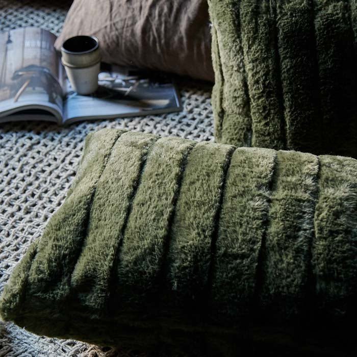 A closeup of the Alayna Faux Fur Cushion showing the ridged stitched detailing.