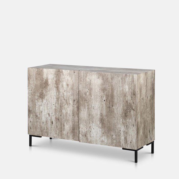 Cutout of Alberton Side Cabinet, a grey, faux concrete side cabinet with four small black metal feet and two cupboard doors.