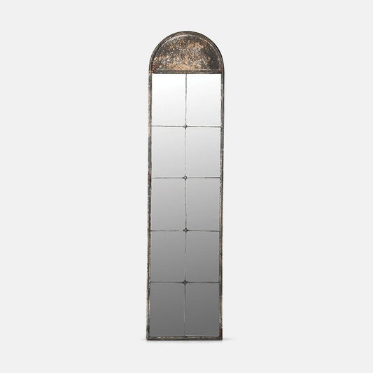 Tall antique-look relief top arch-shaped mirror in window design.