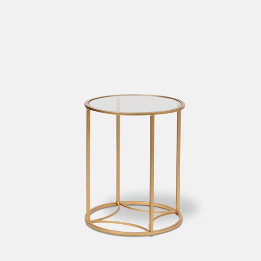 Round glass side table with gold metal frame.