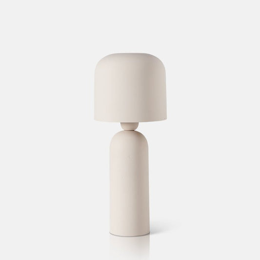 Sleek matte white metal table lamp with curved shade and smooth tapered base.