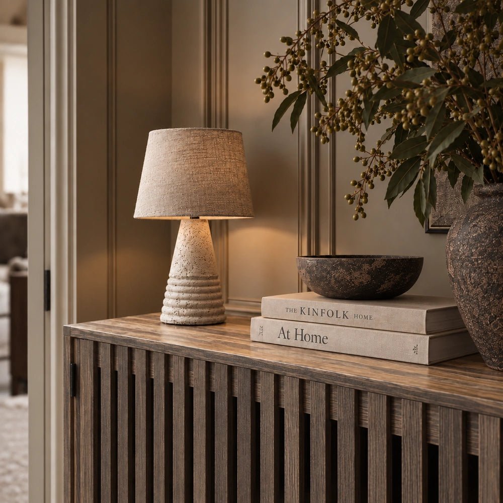 Batten Wooden Sideboard with dark slatted wood frame and contrasting timber doors, styled in a warm contemporary dining room with sculptural decorative objects.
