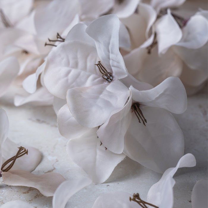 Close up image of the pale blush petals and brown stamen of our artificial bougainvillea flowers.