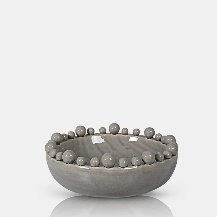 A cutout of the Bourton Bowl - Taupe, a large round bowl with a glossy glazed finish and textural bubble top.