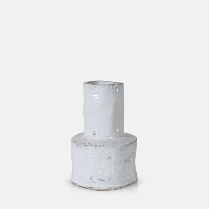 A cutout of the Bremen Vase - Large, a glossy white stoneware vase with a chunky cylindrical base and a rustic feel.