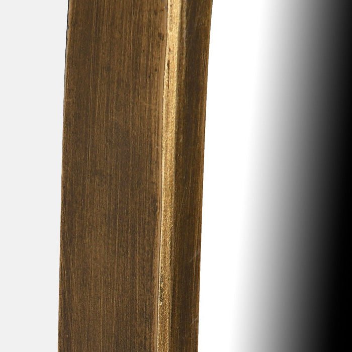 A closeup of the slim gold iron frame of the Casper Mirror - Medium.