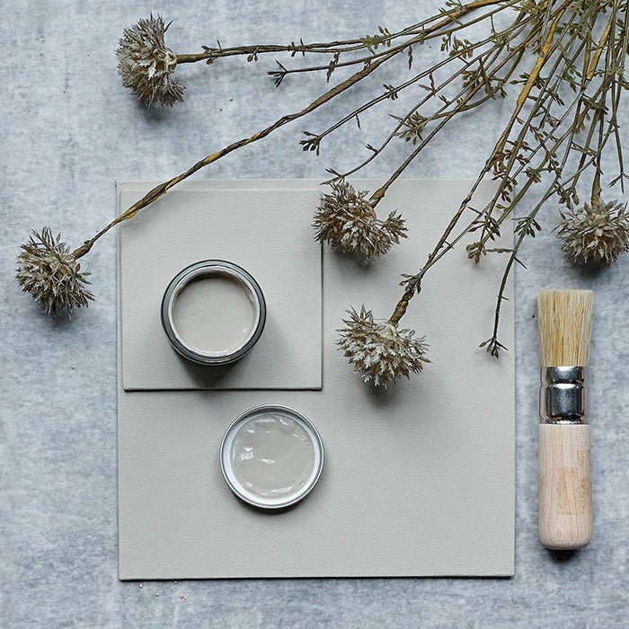 Soft neutral paint colour called cedar styled with a faux botanical and natural paintbrush.