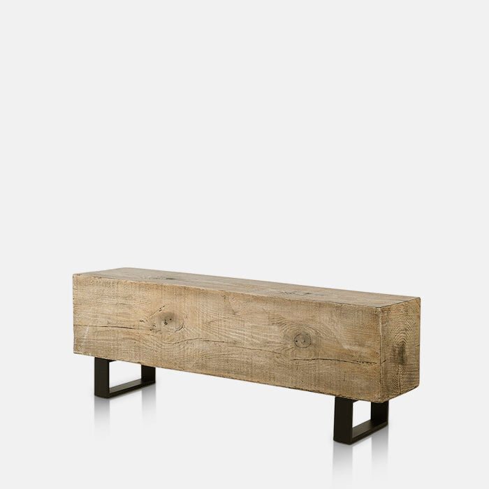 Abigail Ahern Darby Bench with a long, low-slung faux wood-effect top and contrasting black metal legs, featuring a versatile industrial-inspired design for modern interiors.