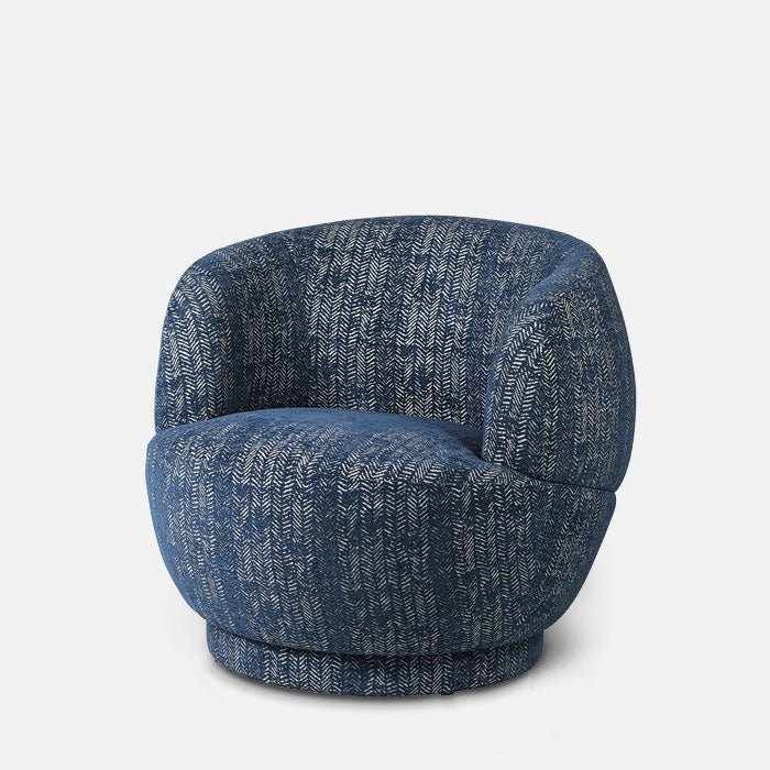 Cutout of the Elliot Occasional Chair, a curvy retro style chair in a navy blue herringbone patterned fabric.