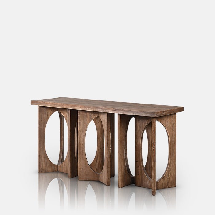Elaborately carved cutout wooden base on a slim console table