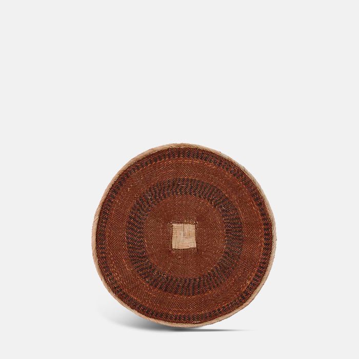 The Fallon Basket, a circular wide shallow woven basket with a geometric tribal pattern