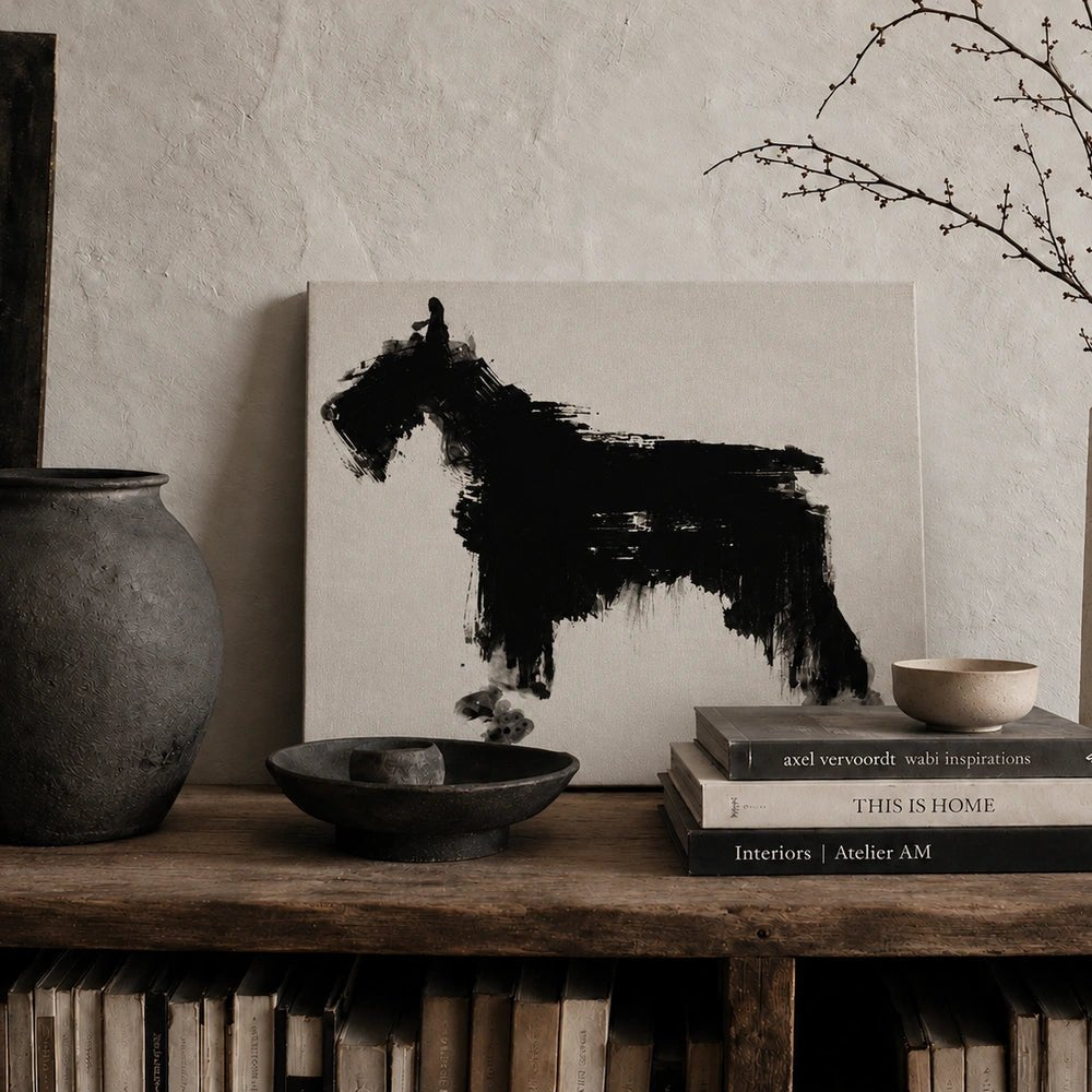 Jasper Dog Print displayed above a dark console table, styled with sculptural lamps, ceramics and decorative objects in a warm neutral interior.