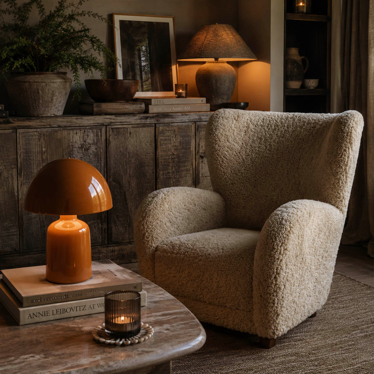 Abigail Ahern Karina Faux Fur Armchair featuring luxuriously soft textured upholstery and a deep, comfortable wingback shape, styled as a cosy accent chair in a contemporary living room.