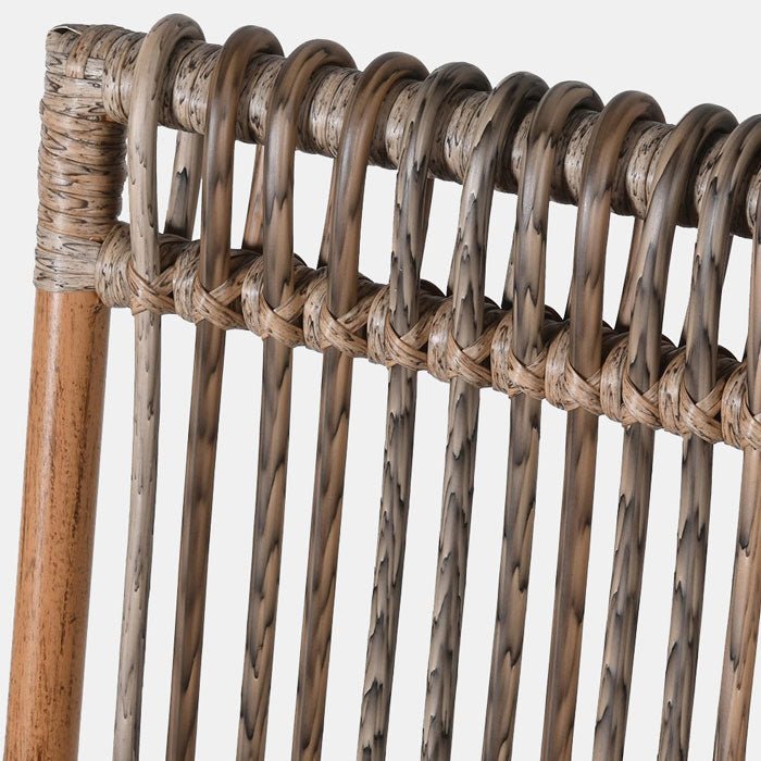 A closeup of the woven rattan back of the Kemble Rattan Occasional Chair.