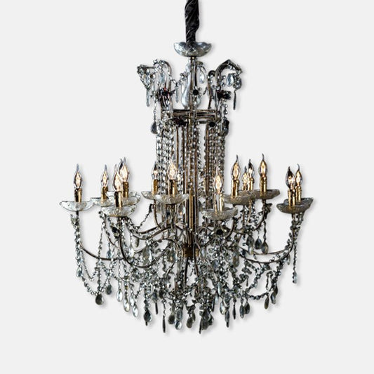 Large ornate chandelier with gold metal frame and clear glass beads.