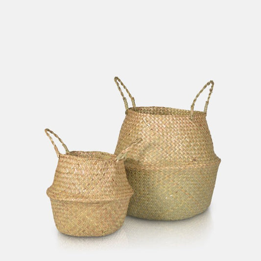 Set of two natural woven seagrass baskets with handles, in two sizes.