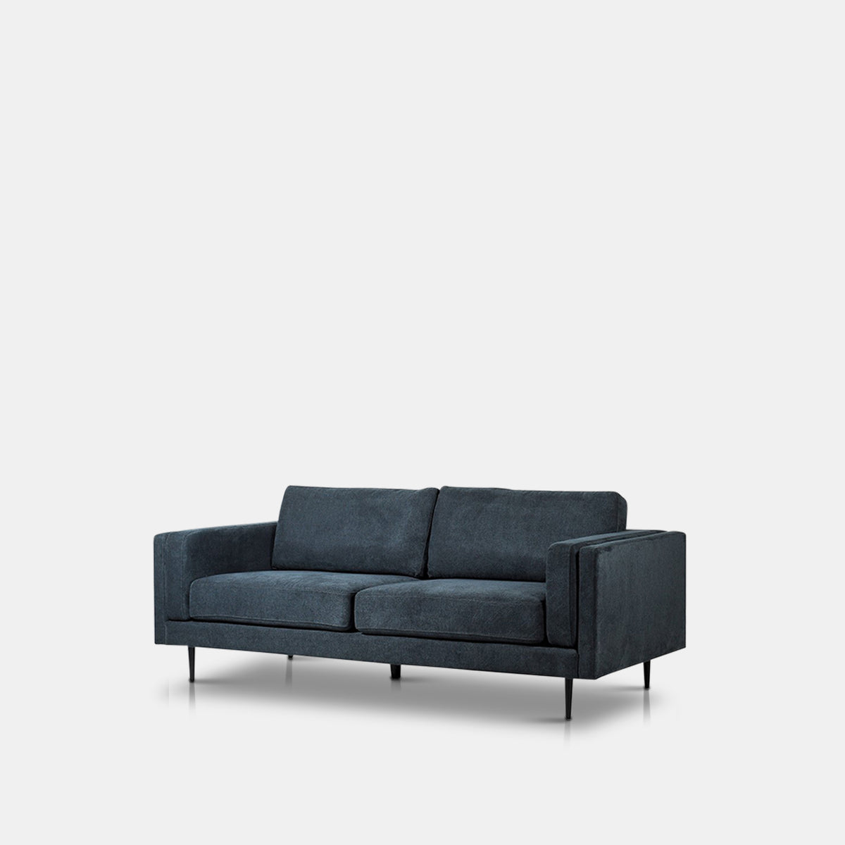 A cutout of the Medford 3 Seater Sofa, an angular design sofa in a deep inky blue velvet.