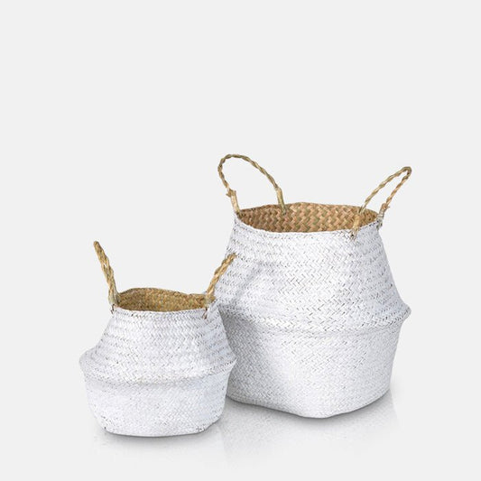 Large and small white woven baskets in a round shape with a natural brown interior