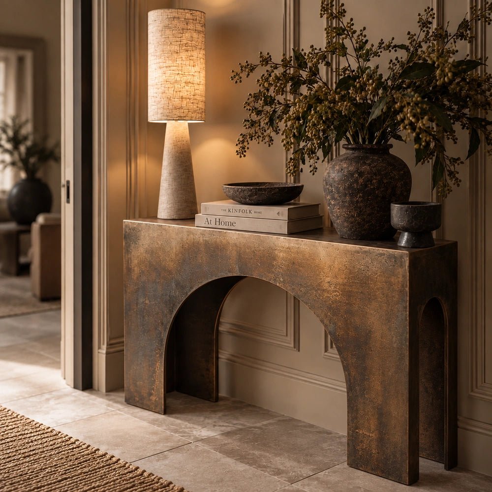 Orcheston Metal Console Table displayed in a softly styled neutral interior, highlighting its slender metallic frame, elegant proportions and contemporary furniture silhouette.