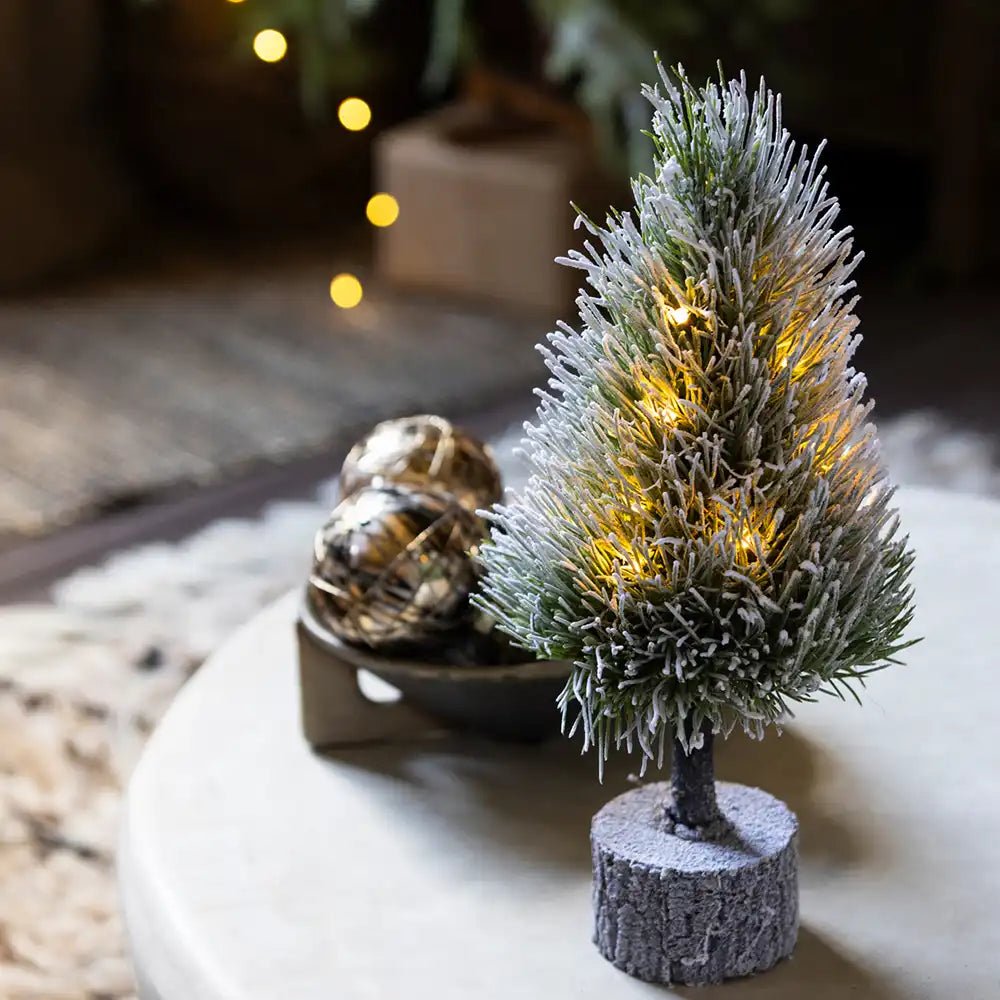 Pre-Lit Mini Christmas Tree with warm glowing lights, adding festive charm to your holiday decor.