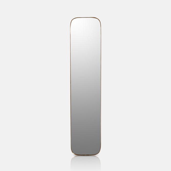 Tall rectangular mirror with a thin gold frame and curved corners