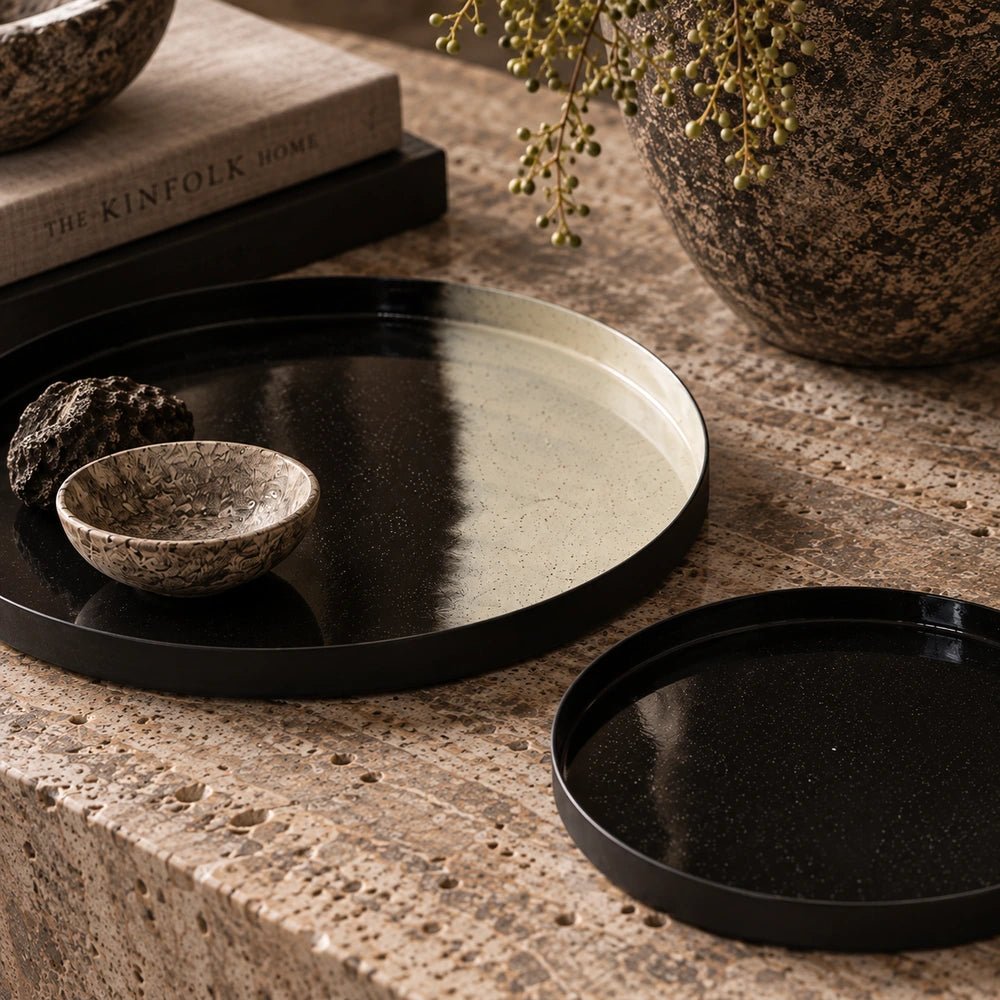 Purton Decorative Trays set of two styled across a coffee table with warm neutral objects, layered textures and contemporary living room accessories.