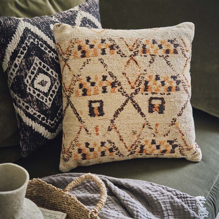 A soft cushion with a aztec style pattern in light earthy colours. Unique home decor from Abigail Ahern to create your dream home.
