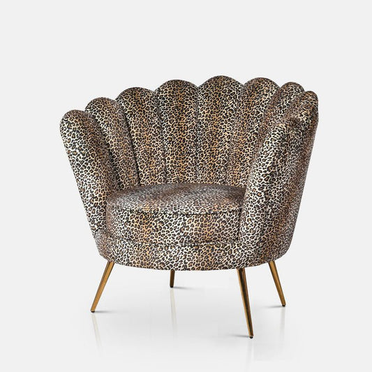 Leopard print chair with cushion and four gold metal legs.
