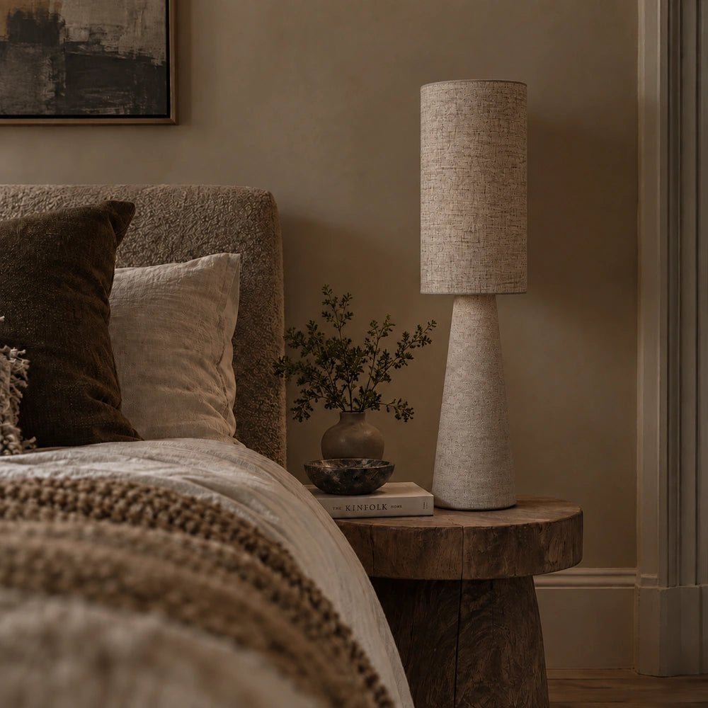 Rollins Large Table Lamp styled on a console with decorative objects, warm neutral tones and layered textures in a contemporary interior setting.