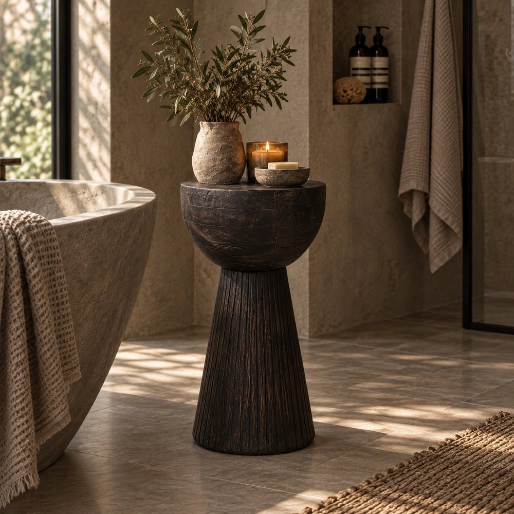 Ronan Black Side Table styled in a warm living room beside upholstered seating, decorative ceramics and softly layered contemporary neutral home accessories.