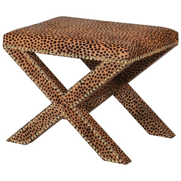 The Chester Leopard Print Stool, a leather upholstered stool with leopard print design. crossed legs and stud edging detail.