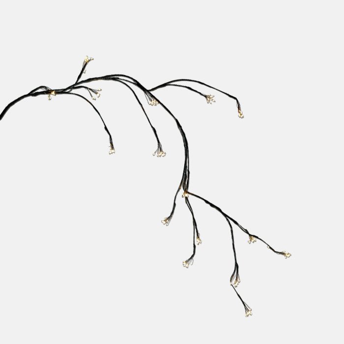 A wired string light moulded to resemble a branch.